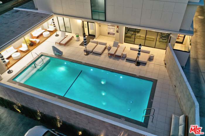 The Doheny Plaza pool illuminated at dusk